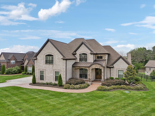 1300 Stovall Ln, Mount Juliet, TN 37122 - french country inspired facade featuring a chimney, a standing seam roof, a shingled roof, and brick siding