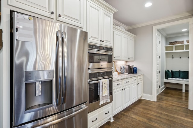 1300 Stovall Ln, Mount Juliet, TN 37122 - kitchen with appliances with stainless steel finishes, crown molding, white cabinets, dark wood-type flooring, and decorative backsplash