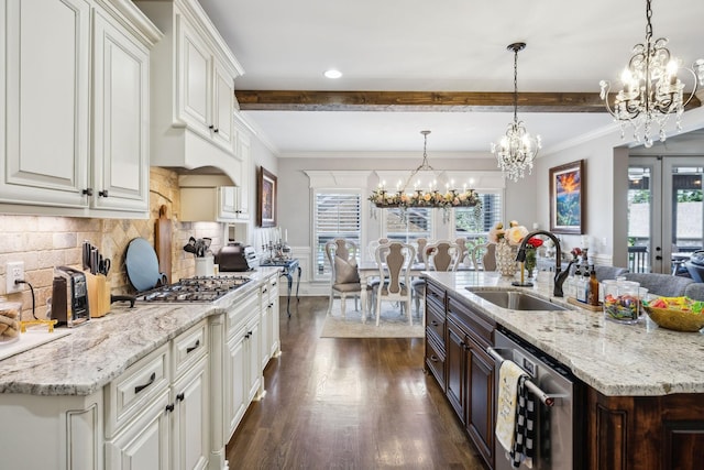 1300 Stovall Ln, Mount Juliet, TN 37122 - kitchen featuring appliances with stainless steel finishes, a chandelier, beamed ceiling, plenty of natural light, and crown molding