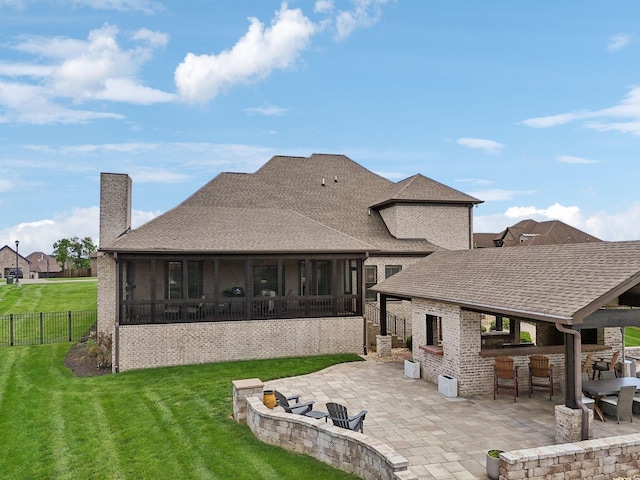 1300 Stovall Ln, Mount Juliet, TN 37122 - back of house featuring a patio area, a sunroom, brick siding, and a chimney