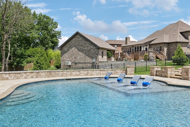 1300 Stovall Ln, Mount Juliet, TN 37122 - view of swimming pool featuring stairway, a fenced backyard, and a wooden deck