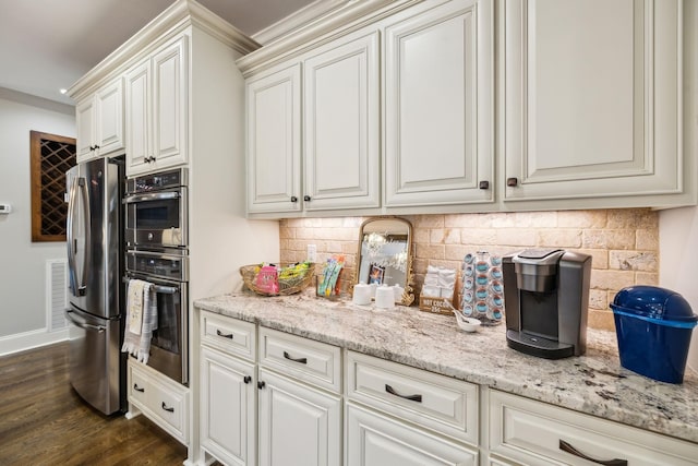 1300 Stovall Ln, Mount Juliet, TN 37122 - kitchen with stainless steel appliances, decorative backsplash, dark wood finished floors, white cabinets, and crown molding