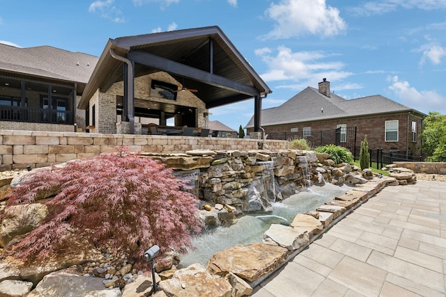 1300 Stovall Ln, Mount Juliet, TN 37122 - exterior space featuring a chimney, brick siding, and a patio