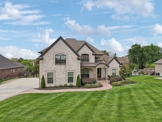 1300 Stovall Ln, Mount Juliet, TN 37122 - french provincial home featuring a standing seam roof, driveway, and brick siding