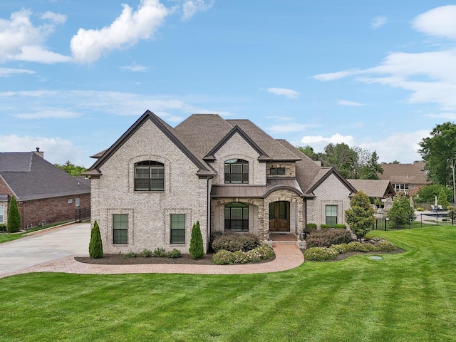 1300 Stovall Ln, Mount Juliet, TN 37122 - french provincial home featuring a standing seam roof, concrete driveway, a metal roof, and roof with shingles