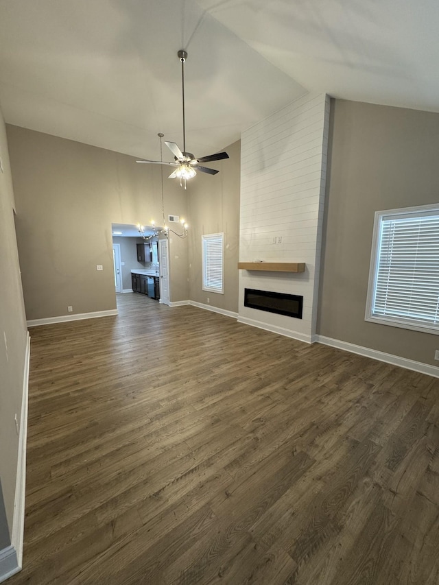 146 Irish Hls, Clarksville, TN 37042 - unfurnished living room with a large fireplace, a ceiling fan, dark wood-type flooring, and high vaulted ceiling
