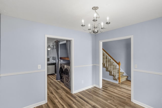 732 Charlie Gann Rd, Old Hickory, TN 37138 - dining room with washing machine and clothes dryer, a chandelier, wood finished floors, and stairs