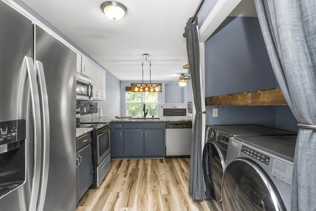 732 Charlie Gann Rd, Old Hickory, TN 37138 - laundry room with washing machine and dryer, light wood-type flooring, and ceiling fan