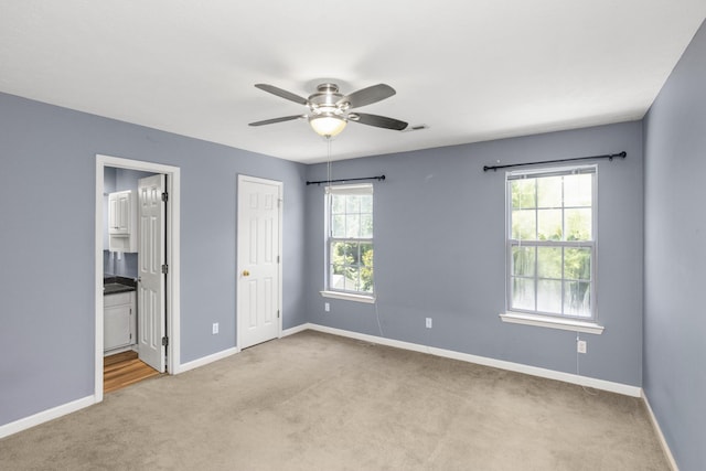 732 Charlie Gann Rd, Old Hickory, TN 37138 - unfurnished bedroom with carpet flooring, connected bathroom, and a ceiling fan