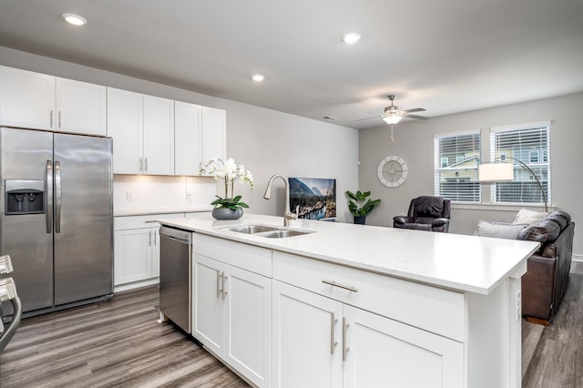 1013 Violet St, Spring Hill, TN 37174 - kitchen with appliances with stainless steel finishes, open floor plan, ceiling fan, wood finished floors, and recessed lighting