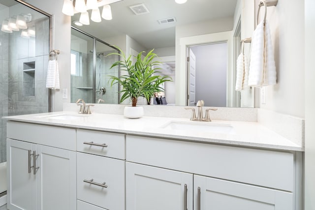 1013 Violet St, Spring Hill, TN 37174 - bathroom featuring double vanity and a tile shower