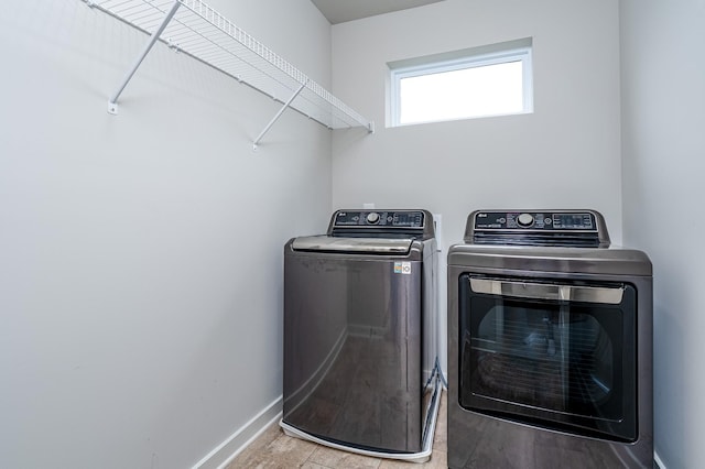 1013 Violet St, Spring Hill, TN 37174 - laundry area featuring separate washer and dryer and wood finished floors