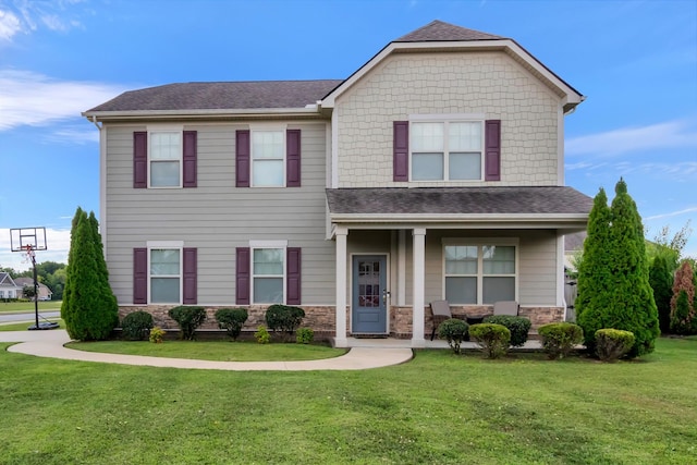 4905 Kingdom Dr, Murfreesboro, TN 37128 - view of front of home with stone siding, a shingled roof, a front yard, and a porch