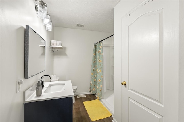 2720 Buckner Rd, Thompsons Station, TN 37179 - full bathroom with wood finished floors, vanity, a shower with curtain, and a textured ceiling