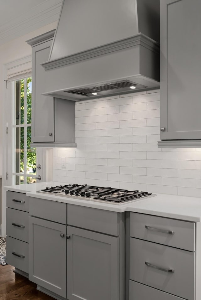 1450 Championship Blvd, Franklin, TN 37064 - kitchen with gray cabinetry, premium range hood, backsplash, dark wood-style floors, and light countertops