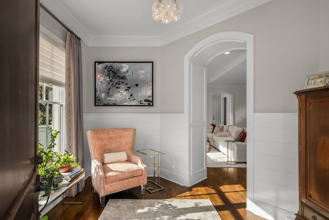 1450 Championship Blvd, Franklin, TN 37064 - living area featuring arched walkways, ornamental molding, wood finished floors, a wainscoted wall, and a chandelier
