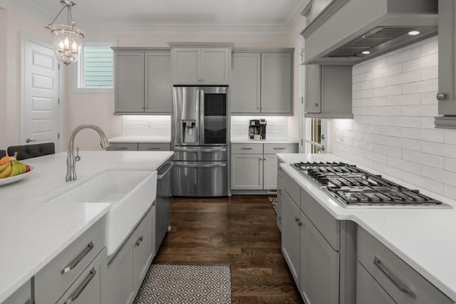 1450 Championship Blvd, Franklin, TN 37064 - kitchen with gray cabinetry, appliances with stainless steel finishes, custom range hood, and crown molding