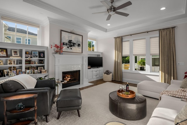 1450 Championship Blvd, Franklin, TN 37064 - living room with a raised ceiling, a fireplace with flush hearth, a ceiling fan, healthy amount of natural light, and crown molding