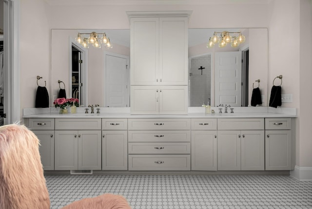 1450 Championship Blvd, Franklin, TN 37064 - bathroom with double vanity, tiled shower, and a chandelier