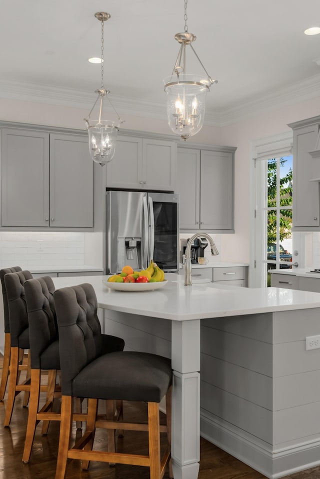 1450 Championship Blvd, Franklin, TN 37064 - kitchen featuring a chandelier, gray cabinets, stainless steel fridge with ice dispenser, and crown molding