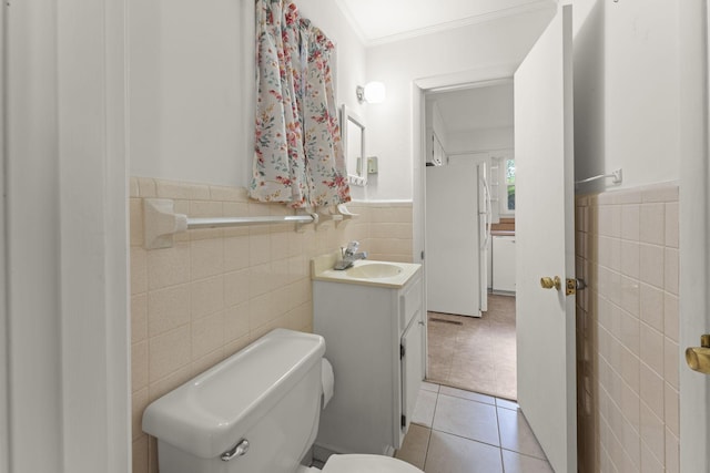 307 Mary Sharp Dr, Decherd, TN 37324 - bathroom featuring tile walls, tile patterned floors, vanity, wainscoting, and crown molding