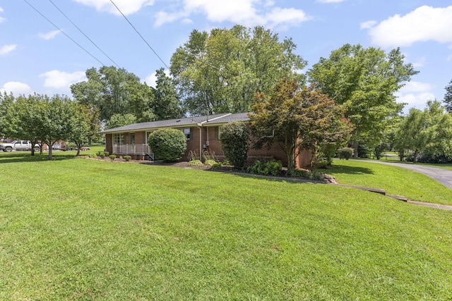 307 Mary Sharp Dr, Decherd, TN 37324 - view of front of house featuring a front lawn and brick siding