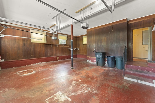 307 Mary Sharp Dr, Decherd, TN 37324 - garage with wood walls, a garage door opener, and electric panel