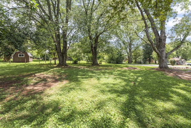 307 Mary Sharp Dr, Decherd, TN 37324 - view of green lawn featuring an outdoor structure and a barn