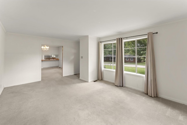 307 Mary Sharp Dr, Decherd, TN 37324 - spare room featuring ornamental molding, a chandelier, and light carpet