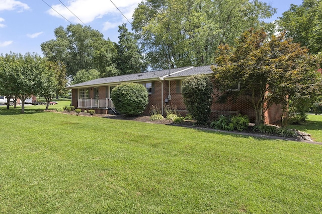 307 Mary Sharp Dr, Decherd, TN 37324 - ranch-style house featuring a front yard and brick siding