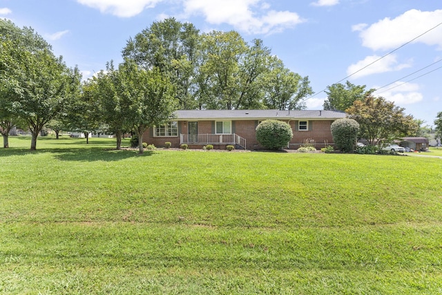 307 Mary Sharp Dr, Decherd, TN 37324 - ranch-style home with a front lawn and brick siding