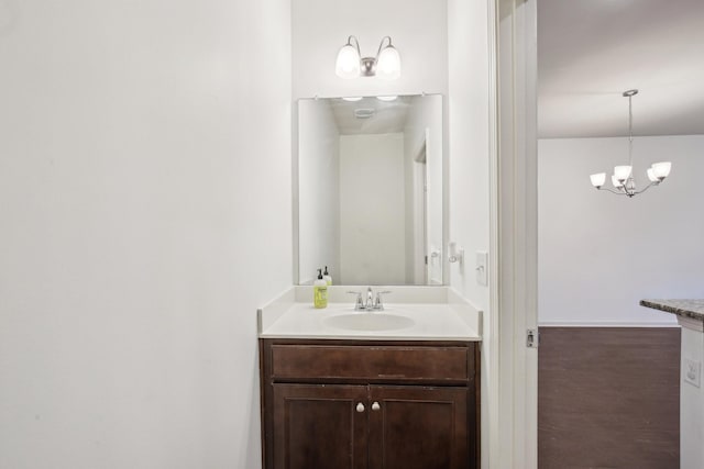 3927 Cannonsgate Ln, Murfreesboro, TN 37128 - bathroom featuring vanity, a chandelier, and wood finished floors