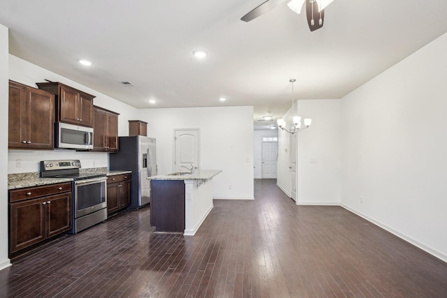 3927 Cannonsgate Ln, Murfreesboro, TN 37128 - kitchen featuring stainless steel appliances, ceiling fan, a chandelier, dark brown cabinets, and an island with sink