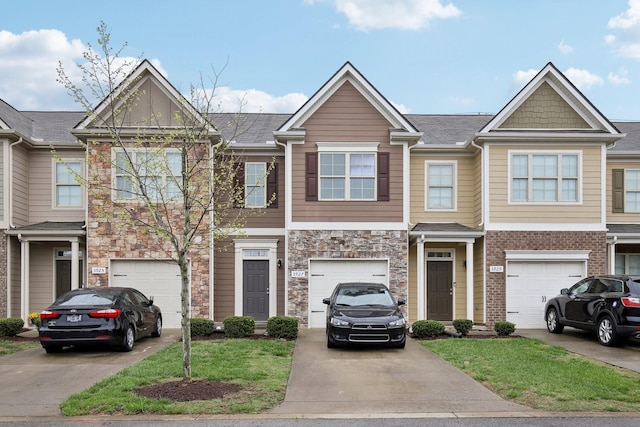 3927 Cannonsgate Ln, Murfreesboro, TN 37128 - craftsman house featuring an attached garage, driveway, stone siding, and roof with shingles