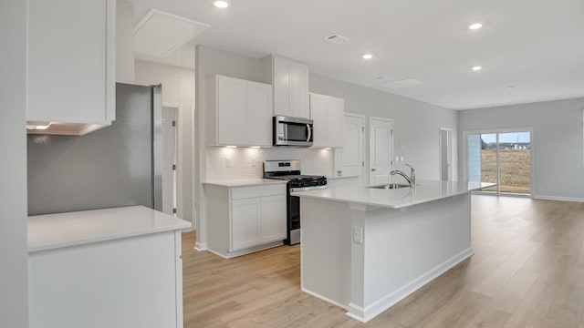 4906 Mowbray Way, Murfreesboro, TN 37129 - kitchen featuring appliances with stainless steel finishes, light wood finished floors, decorative backsplash, white cabinetry, and recessed lighting