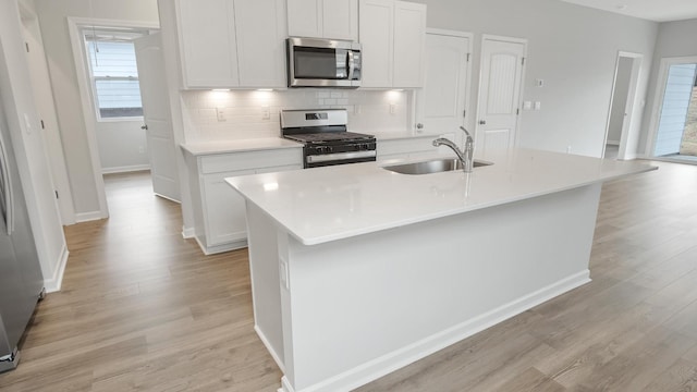 4906 Mowbray Way, Murfreesboro, TN 37129 - kitchen featuring stainless steel appliances, light wood-type flooring, healthy amount of natural light, and decorative backsplash