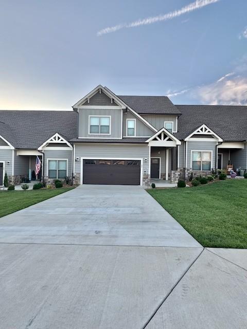 65 Campfire Ct, Winchester, TN 37398 - craftsman-style home with stone siding, concrete driveway, a front lawn, and a garage