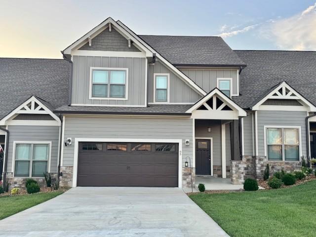 65 Campfire Ct, Winchester, TN 37398 - craftsman-style house with stone siding, board and batten siding, driveway, and a front yard