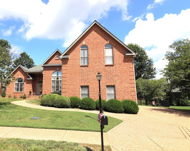 2208 Seven Points Cir, Hermitage, TN 37076 - view of front of house featuring brick siding and a front yard