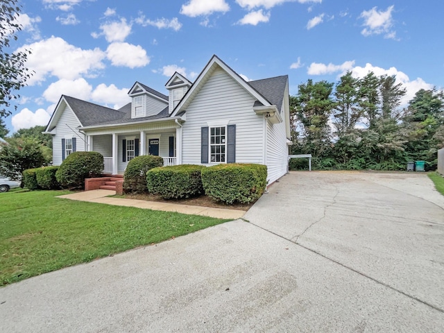 2919 Sams Ct, Spring Hill, TN 37174 - view of front of house featuring a porch, a front yard, concrete driveway, and roof with shingles