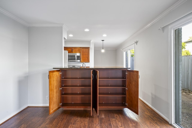 1900 Richard Jones Rd Unit X2, Nashville, TN 37215 - kitchen with dark wood-style floors, ornamental molding, brown cabinetry, recessed lighting, and stainless steel microwave