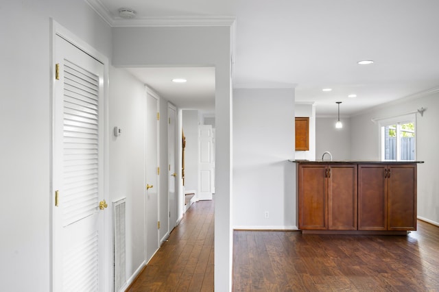 1900 Richard Jones Rd Unit X2, Nashville, TN 37215 - kitchen with dark wood finished floors, ornamental molding, recessed lighting, a peninsula, and brown cabinets