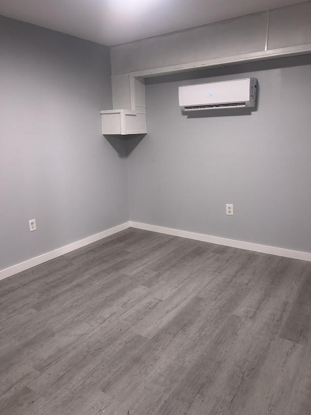 370 Alpine Rd, Camden, TN 38320 - finished below grade area with wood finished floors and an AC wall unit