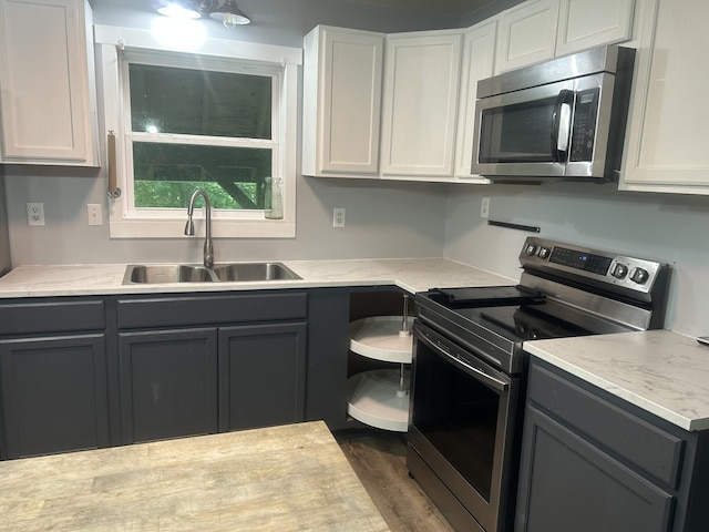 370 Alpine Rd, Camden, TN 38320 - kitchen featuring appliances with stainless steel finishes, light countertops, and gray cabinetry