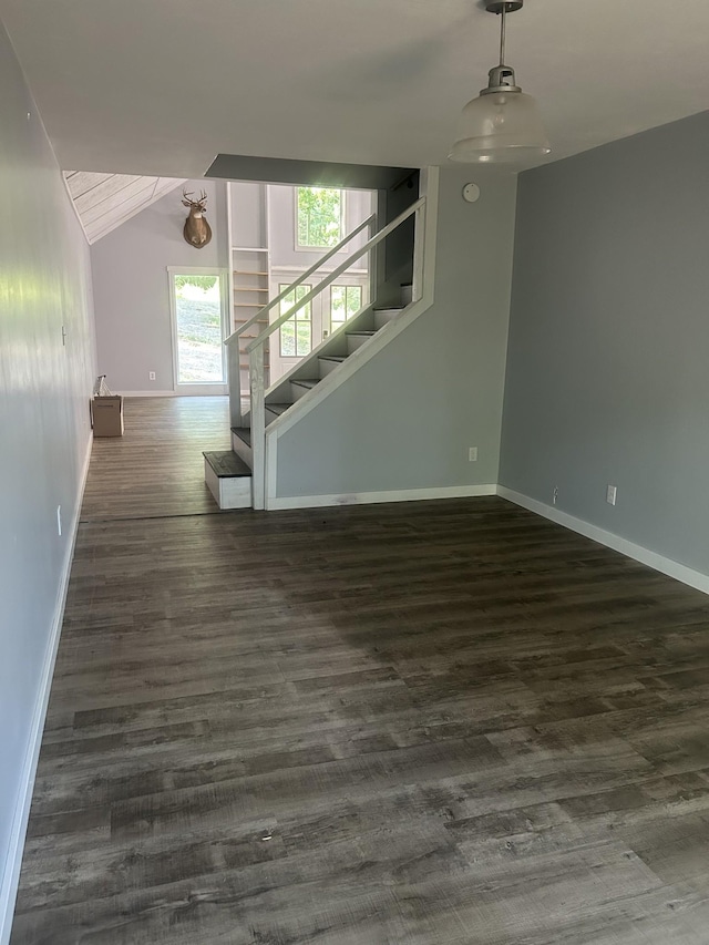 370 Alpine Rd, Camden, TN 38320 - unfurnished living room featuring wood finished floors, stairway, and lofted ceiling