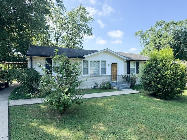 121 Santa Monica Blvd, Gallatin, TN 37066 - ranch-style house with brick siding, a front yard, and a shingled roof