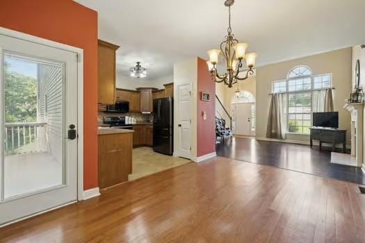 1604 Yarmouth Ct, Old Hickory, TN 37138 - unfurnished dining area featuring light wood-style flooring and a chandelier