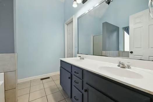 1604 Yarmouth Ct, Old Hickory, TN 37138 - bathroom with double vanity, a garden tub, and tile patterned floors