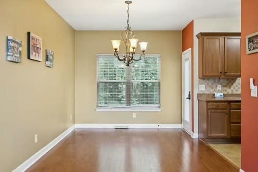 1604 Yarmouth Ct, Old Hickory, TN 37138 - unfurnished dining area featuring a chandelier and wood finished floors