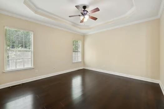 1604 Yarmouth Ct, Old Hickory, TN 37138 - empty room featuring a tray ceiling, crown molding, dark wood-type flooring, and ceiling fan